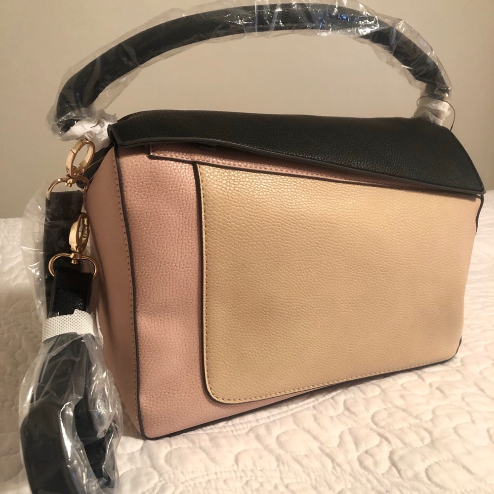 New. Tan, black and pink purse